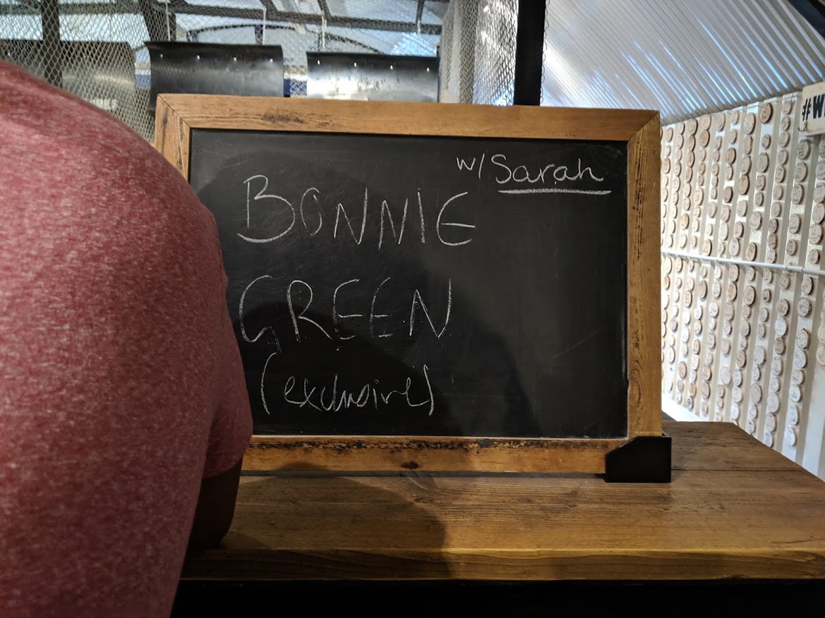 a chalkboard that has 'Bonnie Green Exclusive' written on it